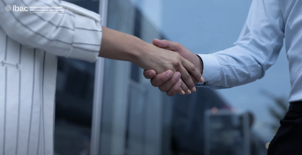 Close up of two business professionals shaking hands