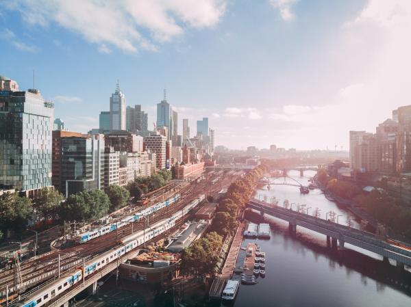An image of Melbourne taken from midway over the Yarra, showcasing Flinders St Statdion. Photo by Dmitry Osipenko on Unsplash