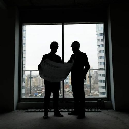 silhouette of construction workers in apartment